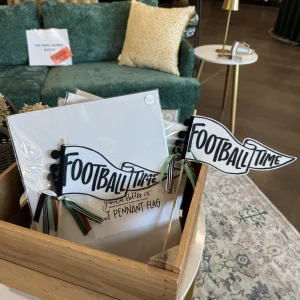 Elegant holiday table setting with candles, greenery, and glassware from The Event Collective.